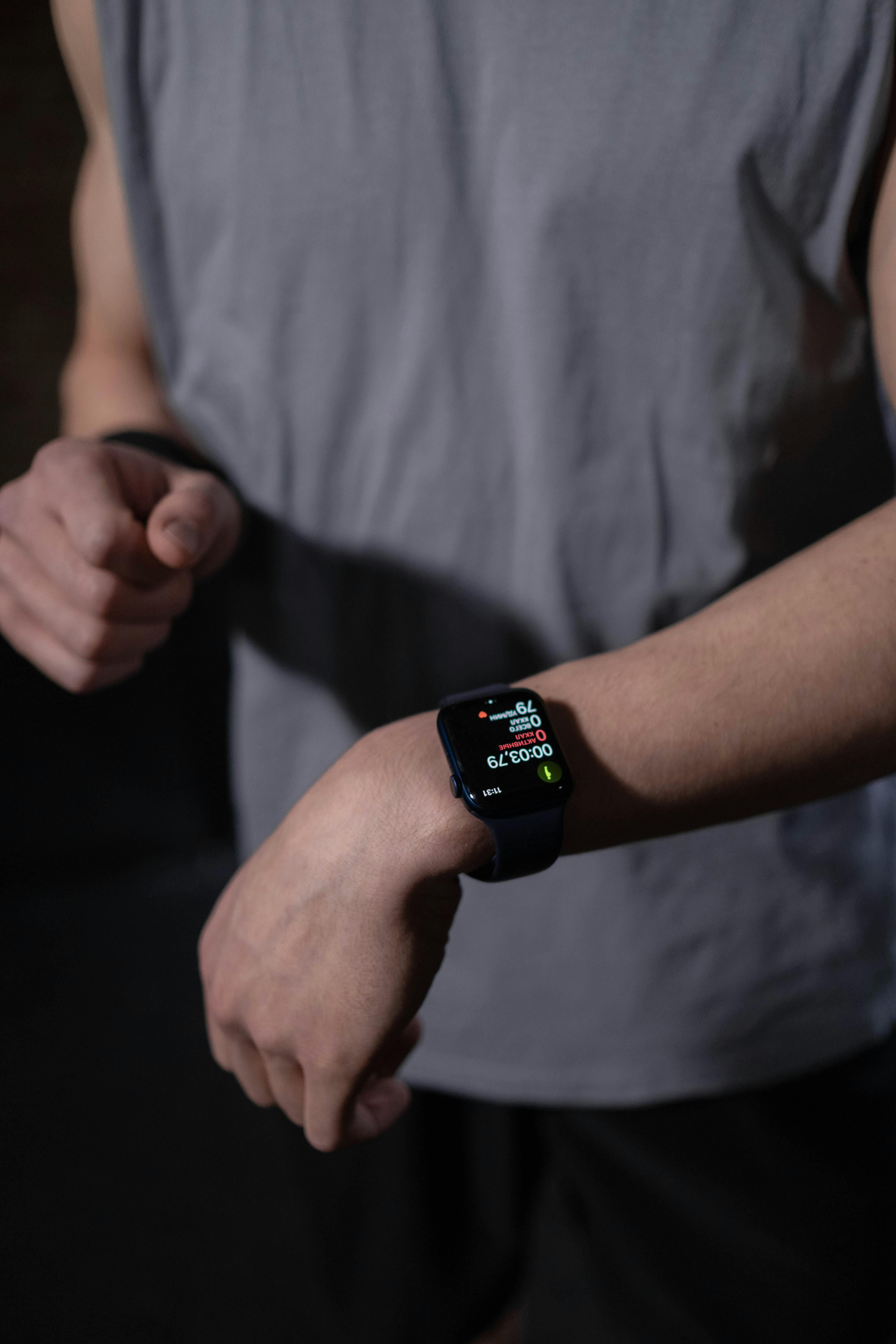 Man checking his apple watch post workout before enjoying a nuwave protein shake