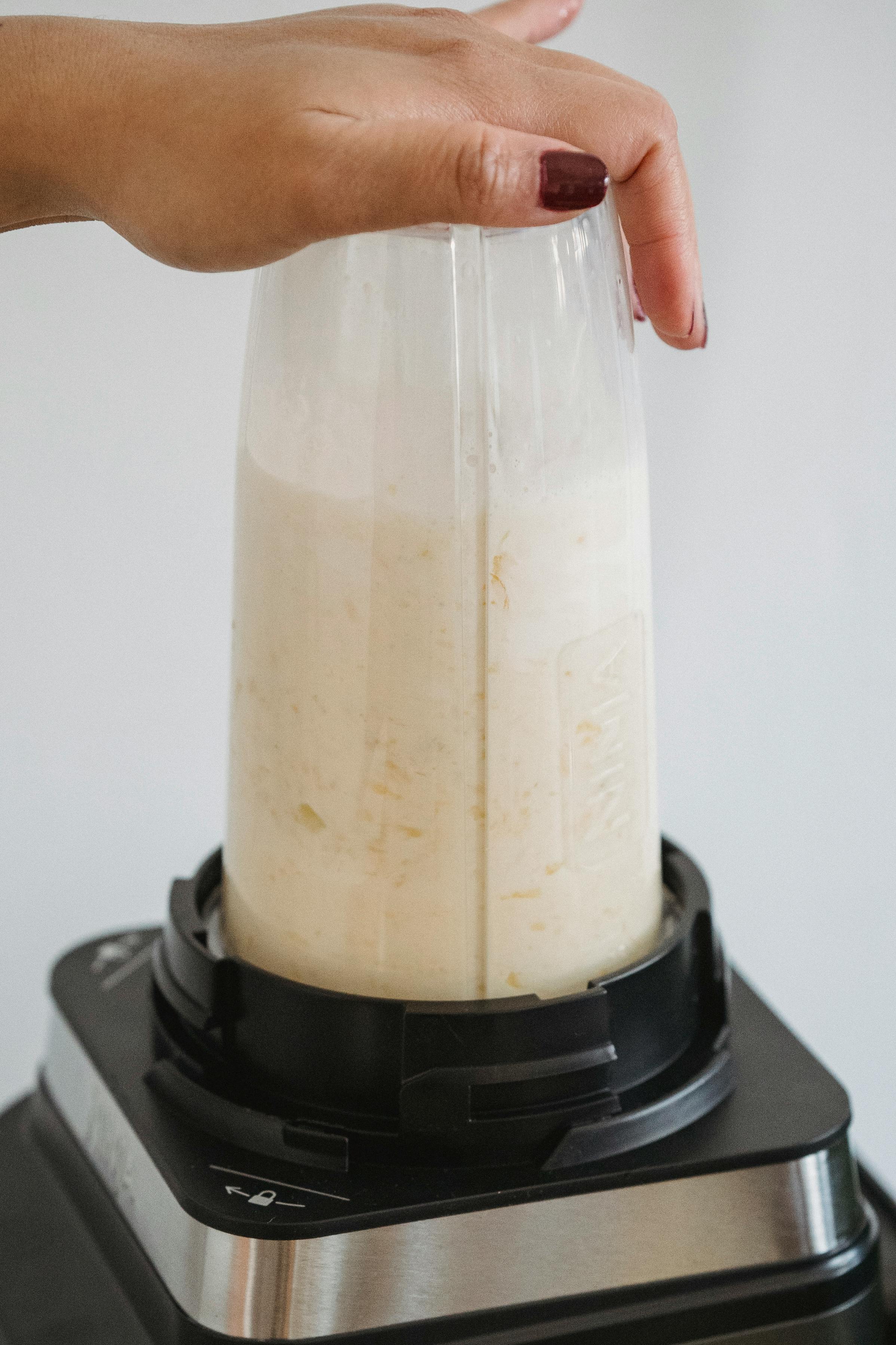 Woman making a vanilla nuwave protein shake to support her healthy lifestyle