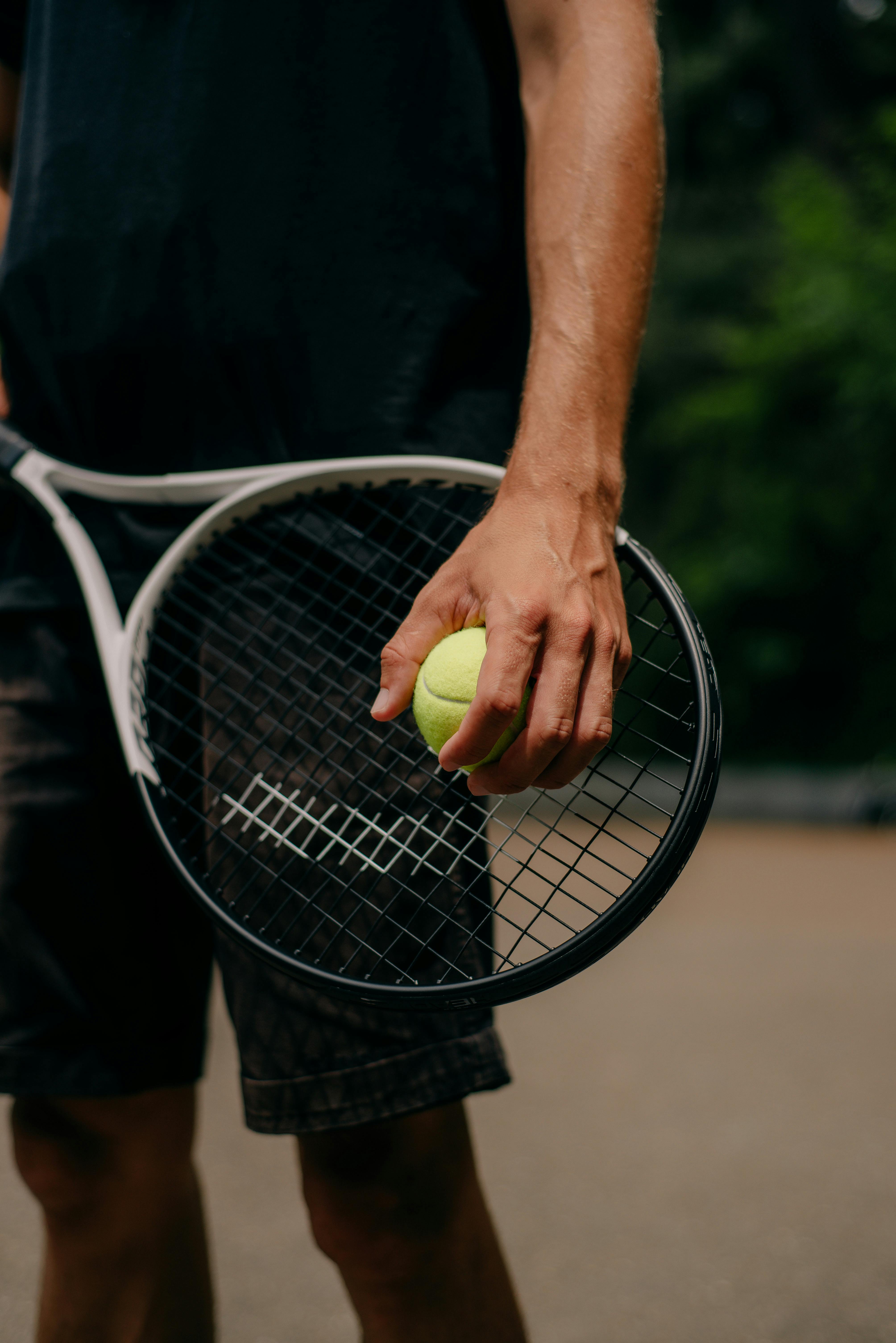 Man playing tennis showing the healthy active lifestyle that nuwave protein products support