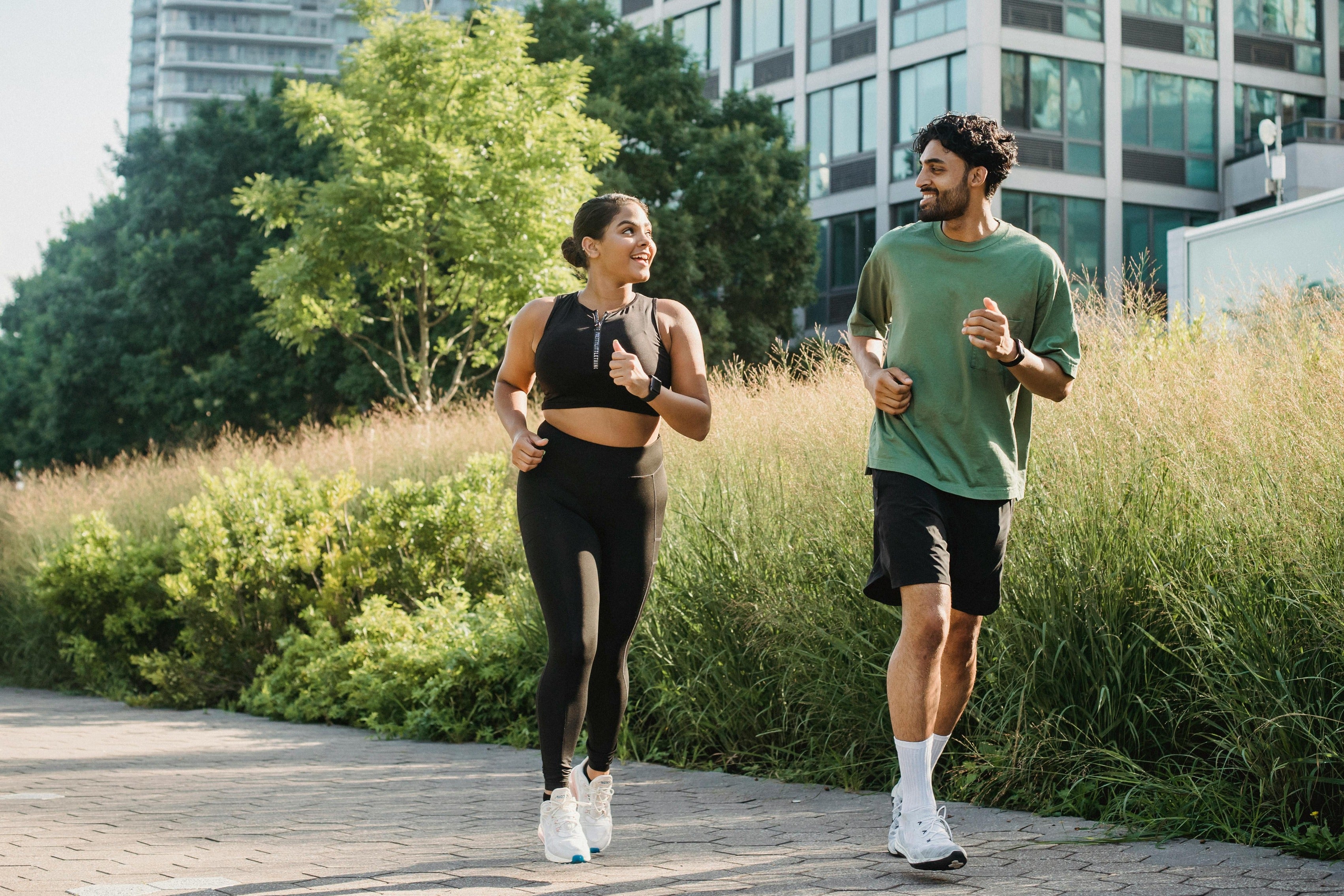 Man and woman running in the park showing the healthy active lifestyle that nuwave products support