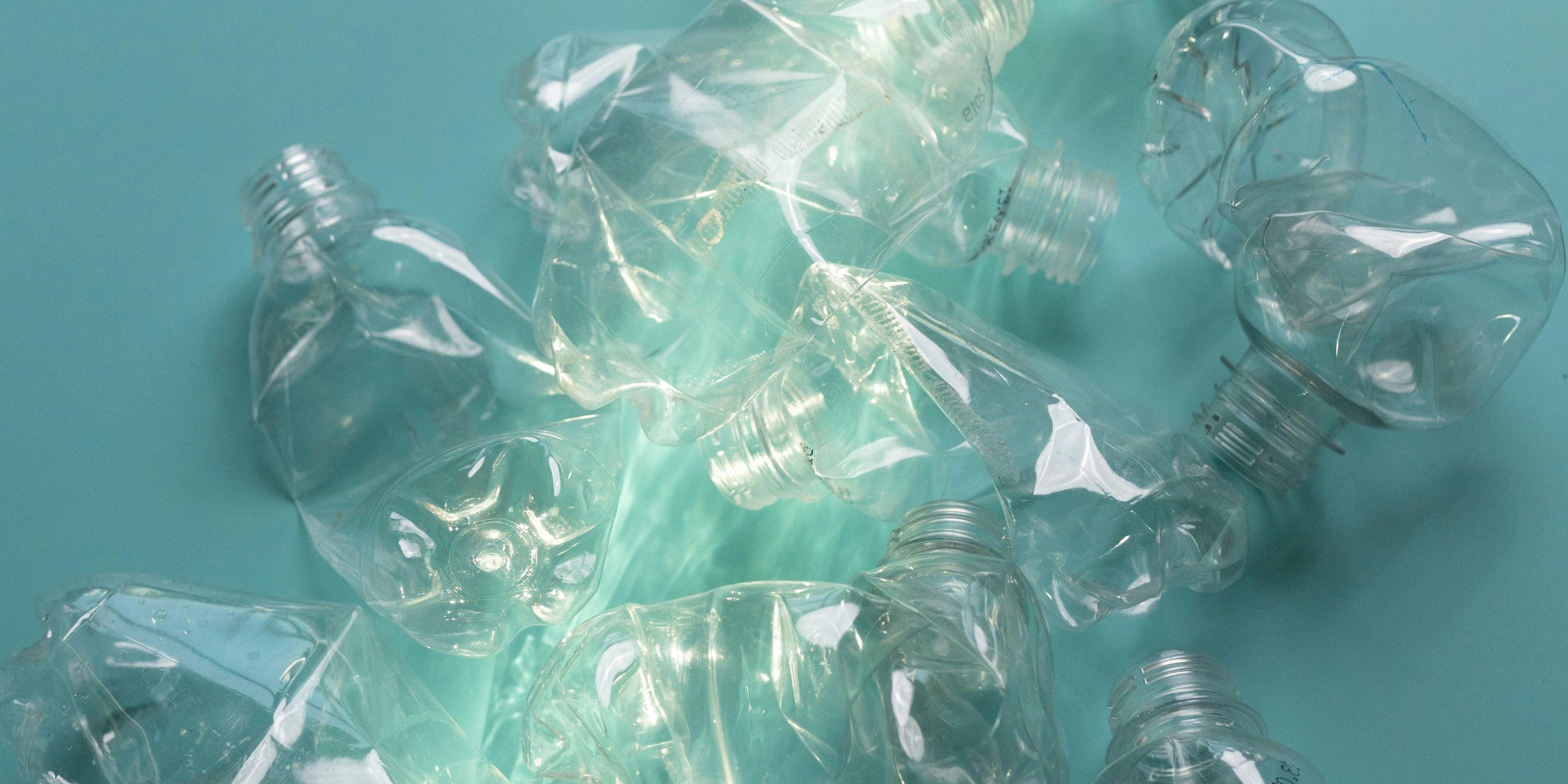 Empty water bottles showing nuwave's commitment to plastic cleanup in partnership with RePurpose Global